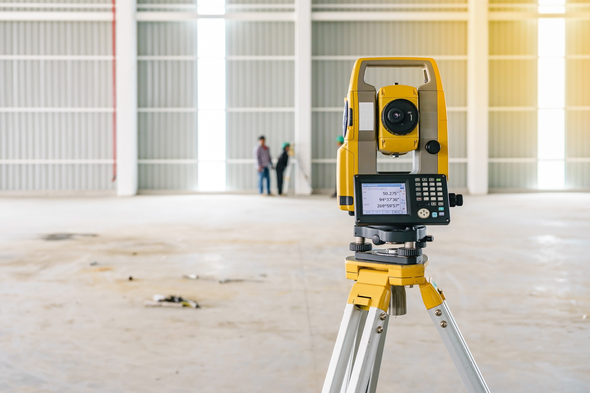 Surveyor equipment tacheometer or theodolite outdoors at construction site